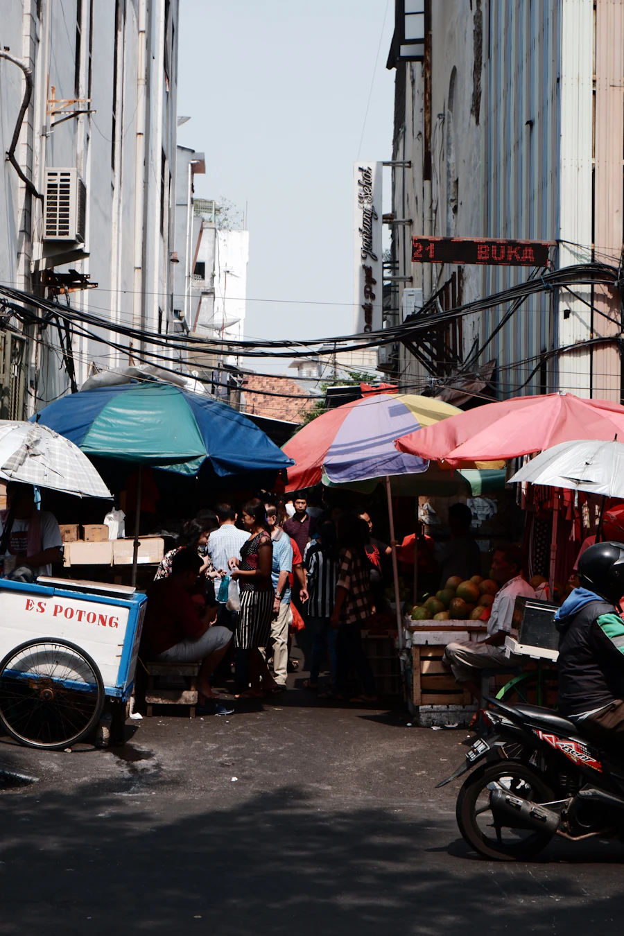 Street market with colourful umbrellas