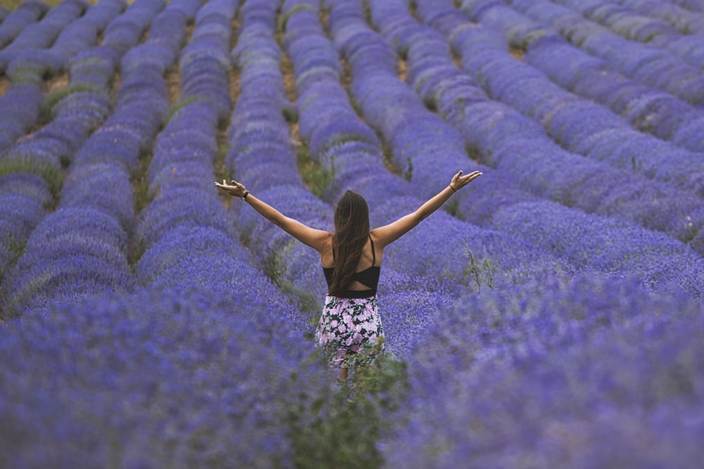 woman standing near lavender pplants