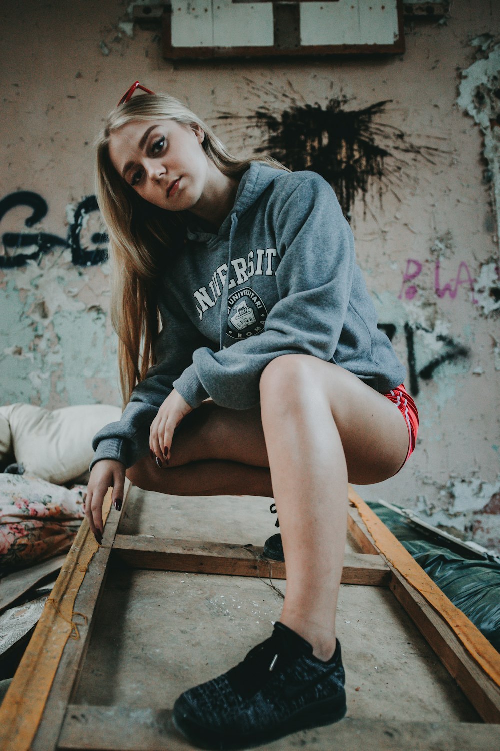 woman crouching on floor