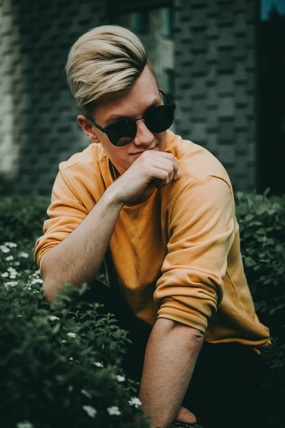 men wearing a black frame sunglasses during daytime close-up photography