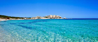 crystal blue water on white sand beach