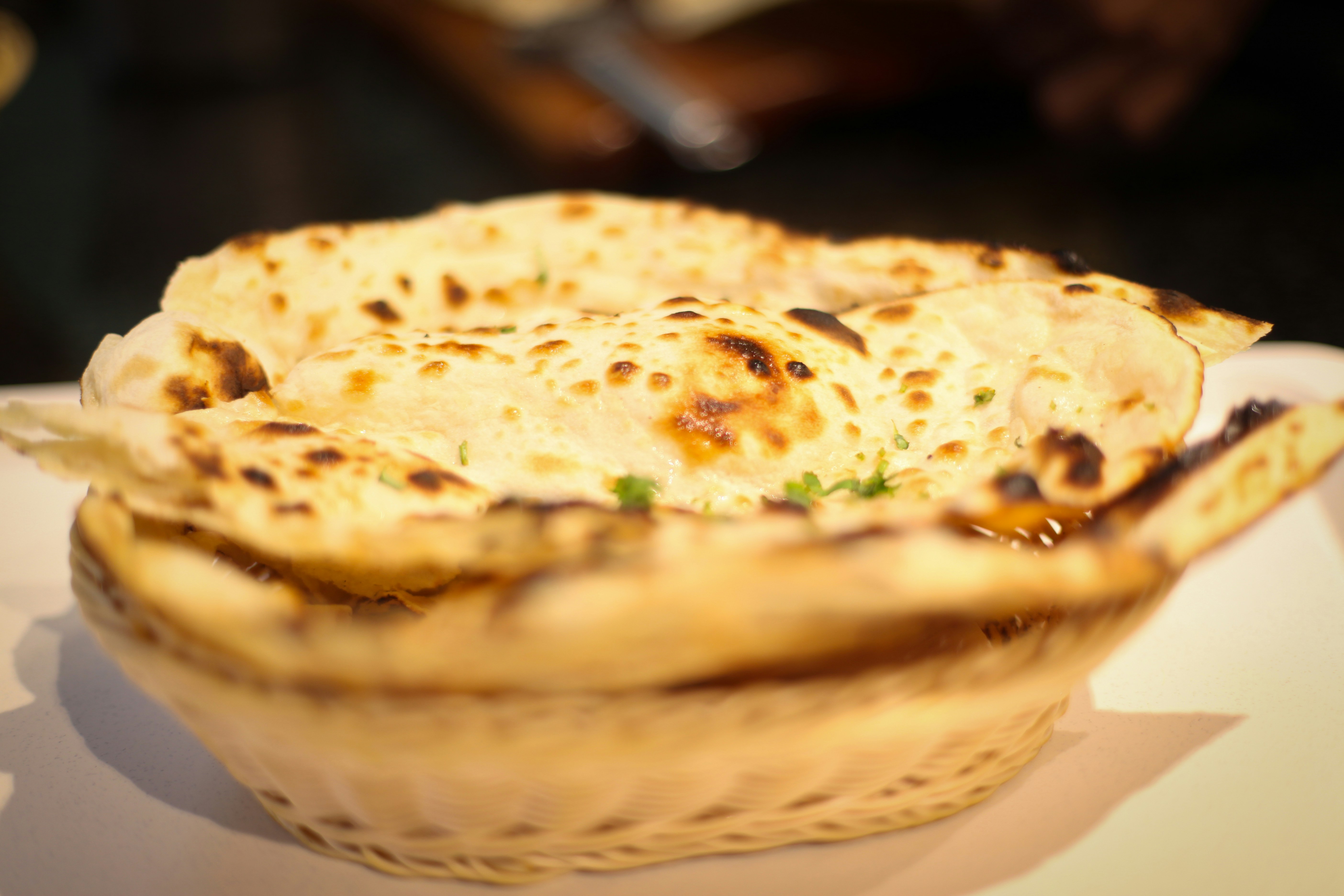 Soft golden butter naan bread freshly baked in tandoor oven