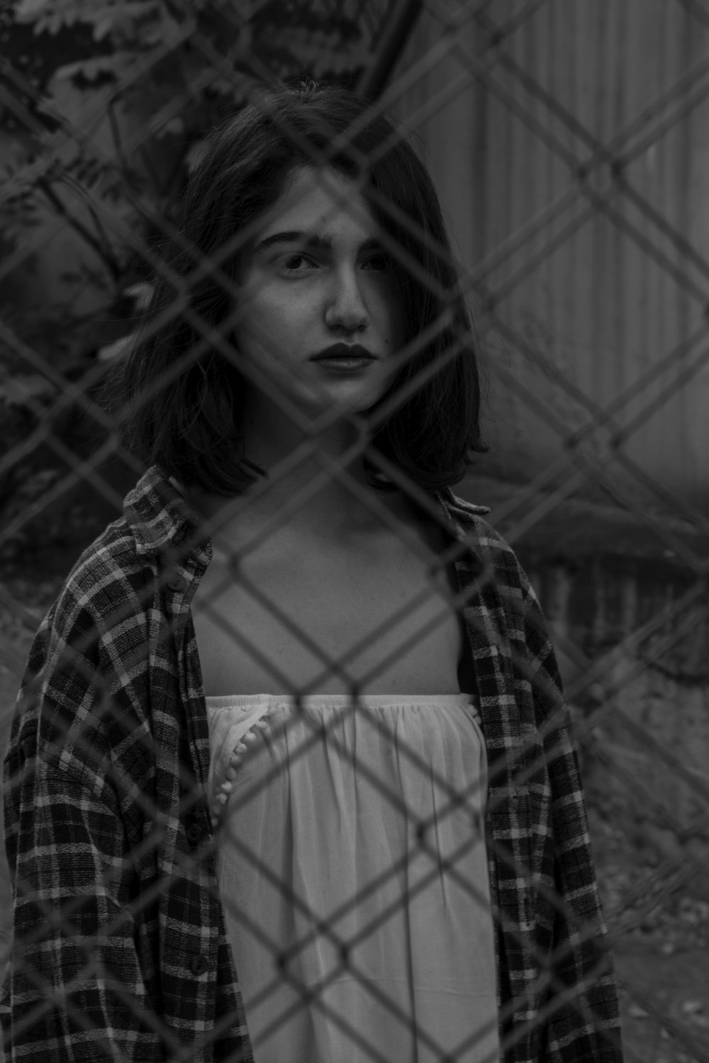 woman standing in front of fence