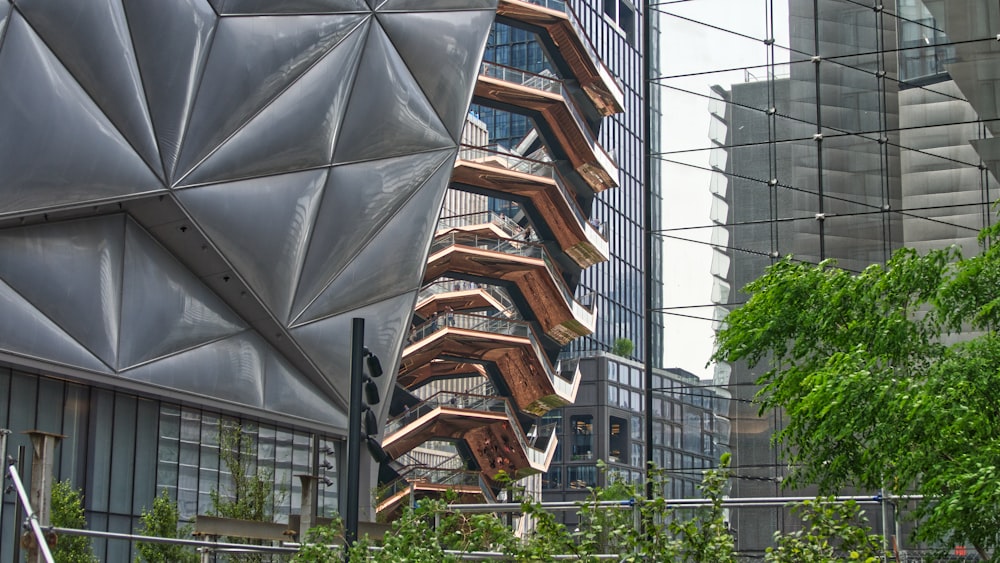 a tall building with a spiral staircase in front of it