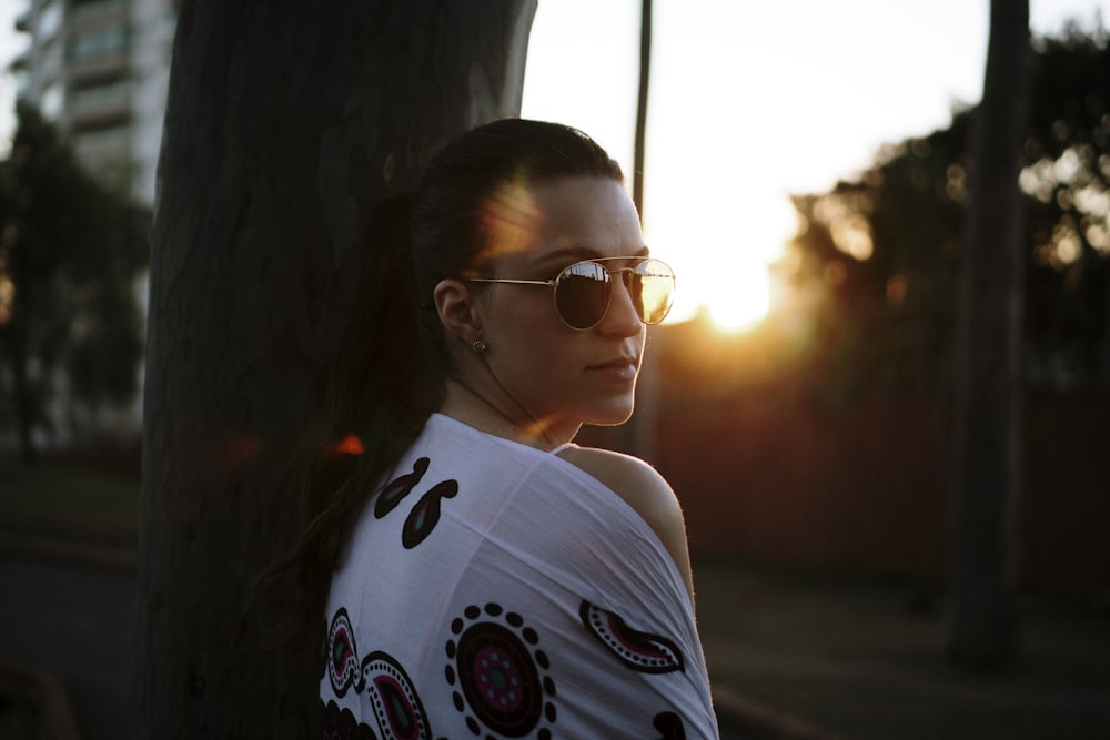 woman leaning near wall