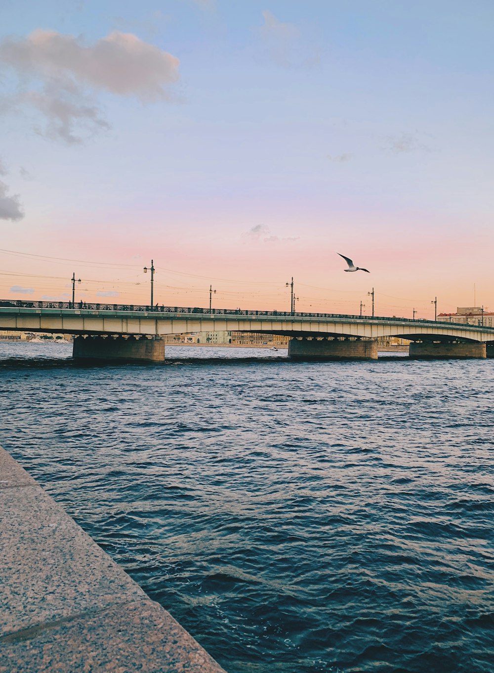 body of water across bridge during daytime