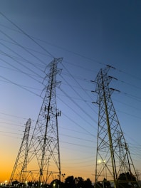 low-angle photography of utility towers