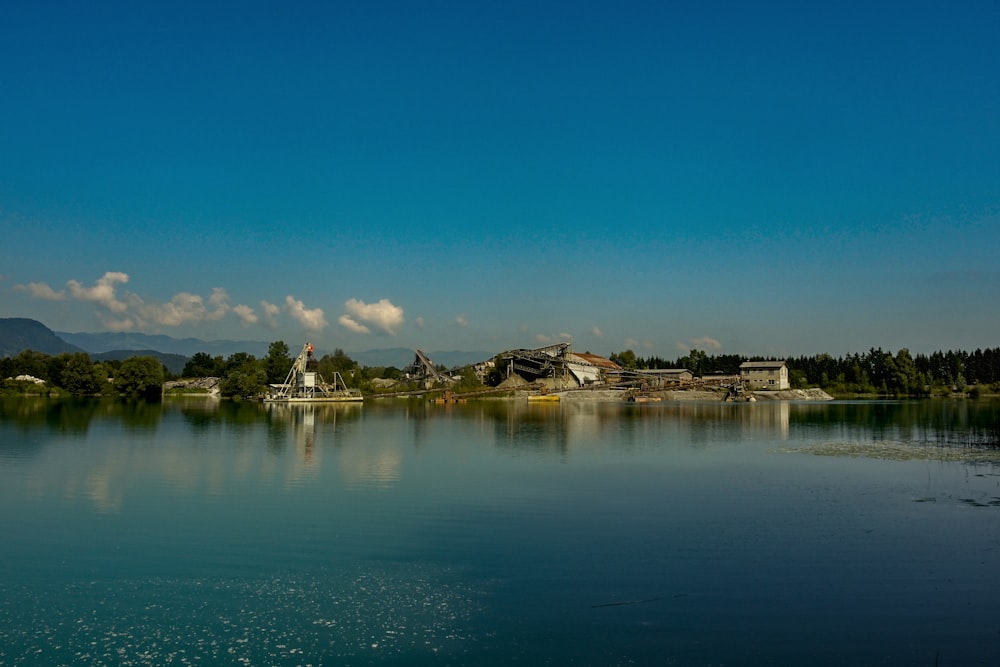 body of water near white strucutre