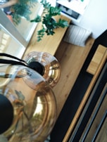 A close-up of a stylish light fixture installed in a dining area.