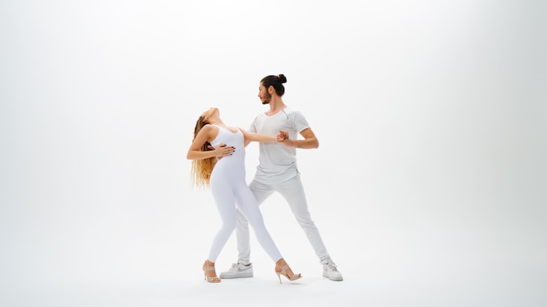 man and woman wearing white tops