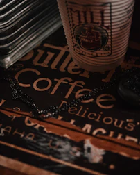 Takeaway packaging featuring elegant, vintage-inspired design with the nhà bếp cổ logo.