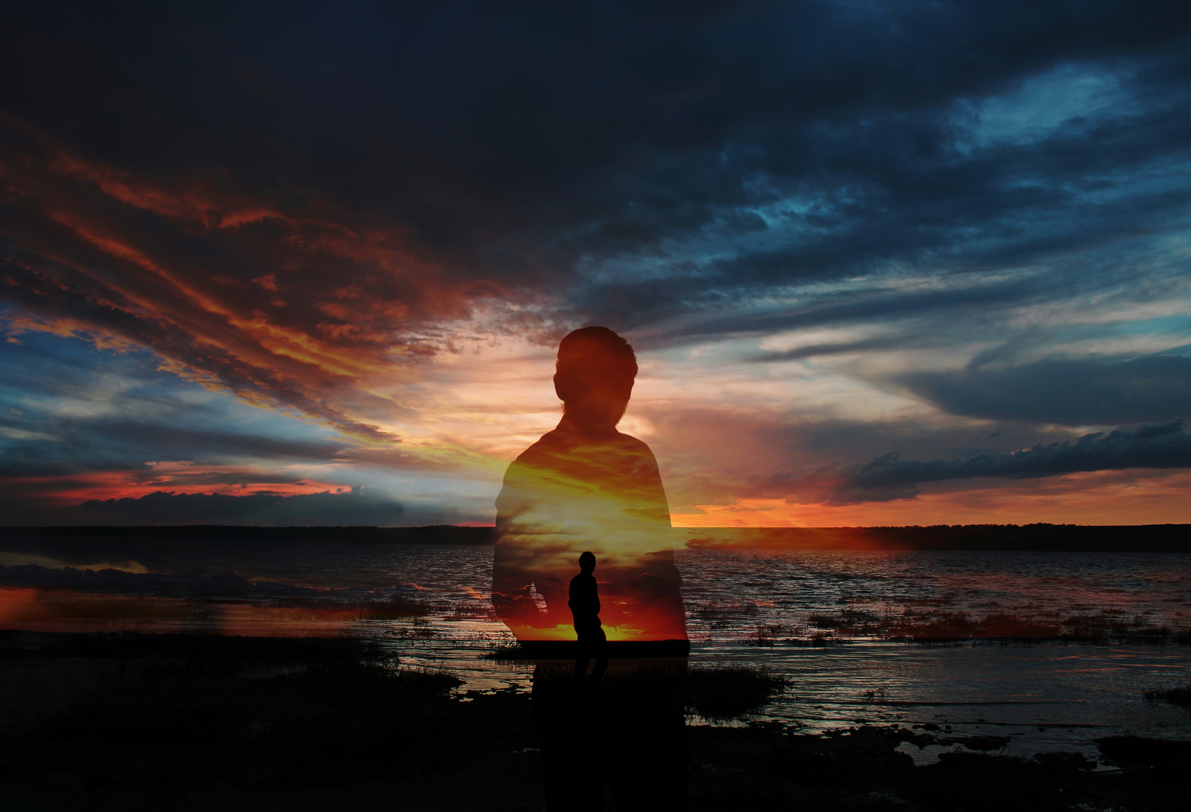a person standing in front of a body of water