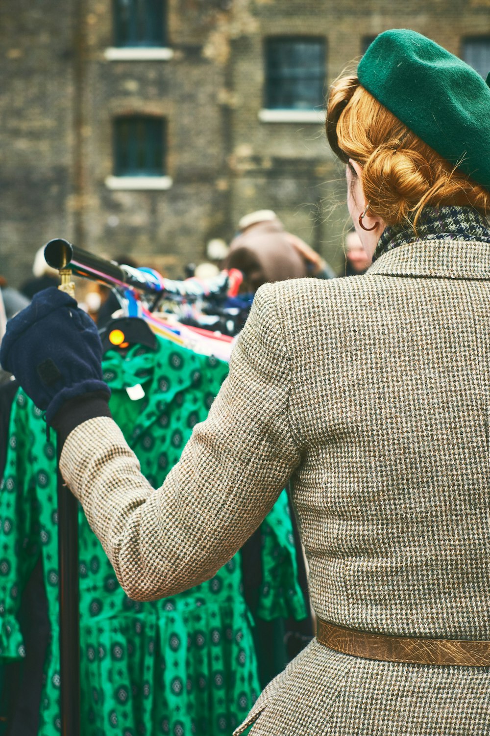 woman looking at green dress