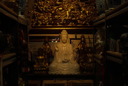 A serene consultation setting with golden accents and spiritual symbols glowing softly