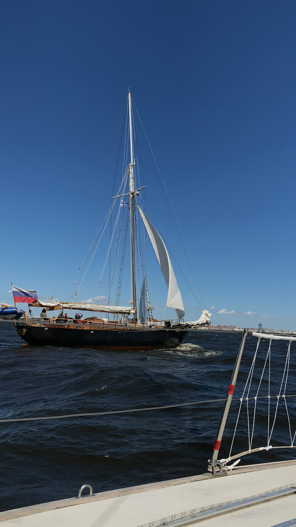 brown and black boat on body of water