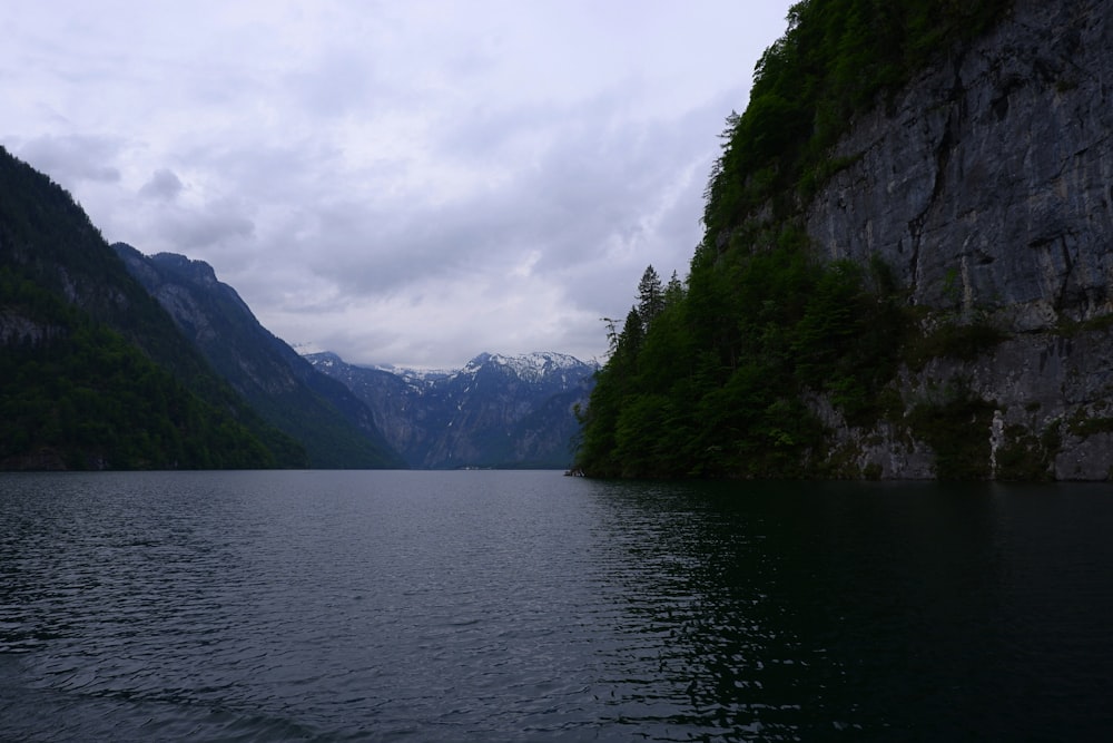 body of water near cliff