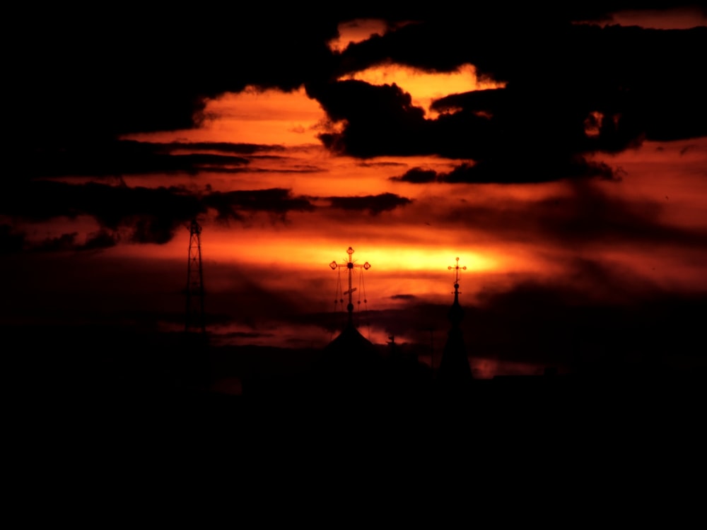 silhouette of cross during sunset