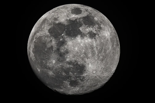 A detailed close-up of Earth's surface textures, emphasizing mountain ranges and ocean depths.