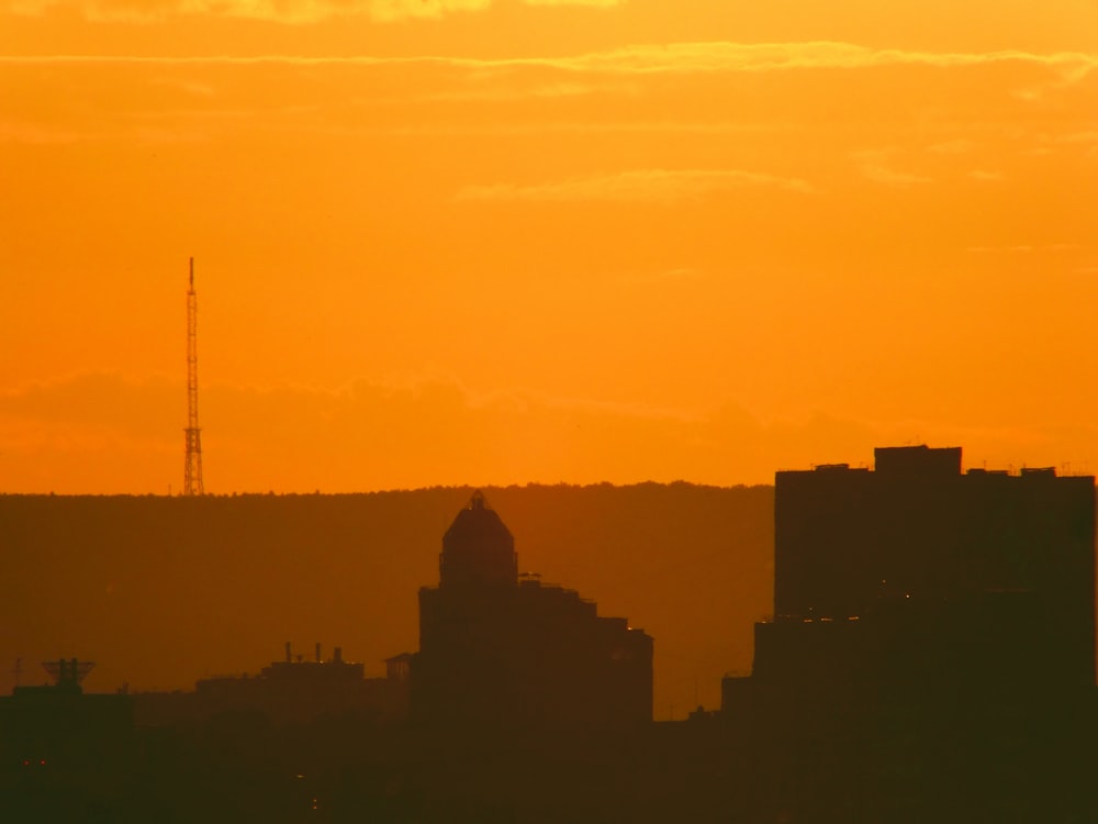 silhouette of buildings during golden hour