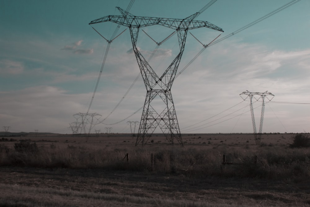 a field with power lines in the distance