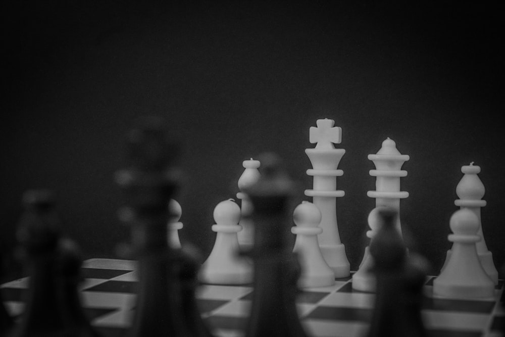 grayscale photo of a chess set