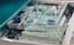 white packs with scissors and medicine on gray tray