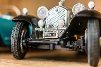 A close-up of a miniature car showcasing its intricate detailing.