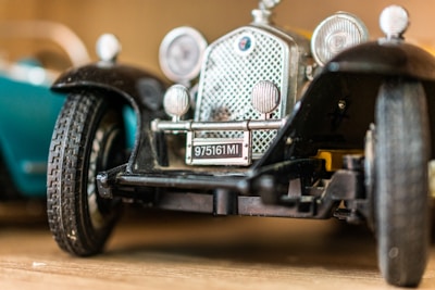 Close-up of a shiny 3D diecast car frame showcasing intricate details and craftsmanship.