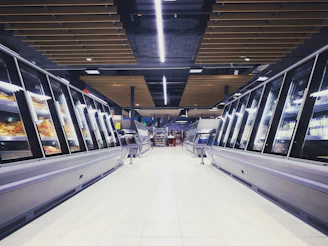 Bright and welcoming supermarket aisle with fresh produce under warm lighting