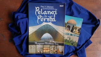Pelangi di Persia book on blue apparel