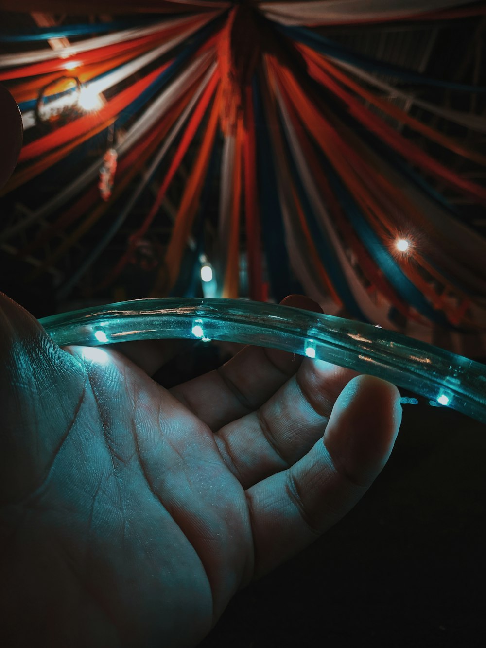 white LED rope light held by a hand