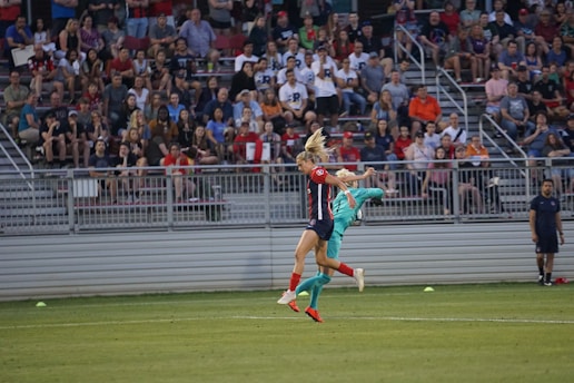 A vibrant indoor soccer match in action, showcasing players in dynamic poses on the field.
