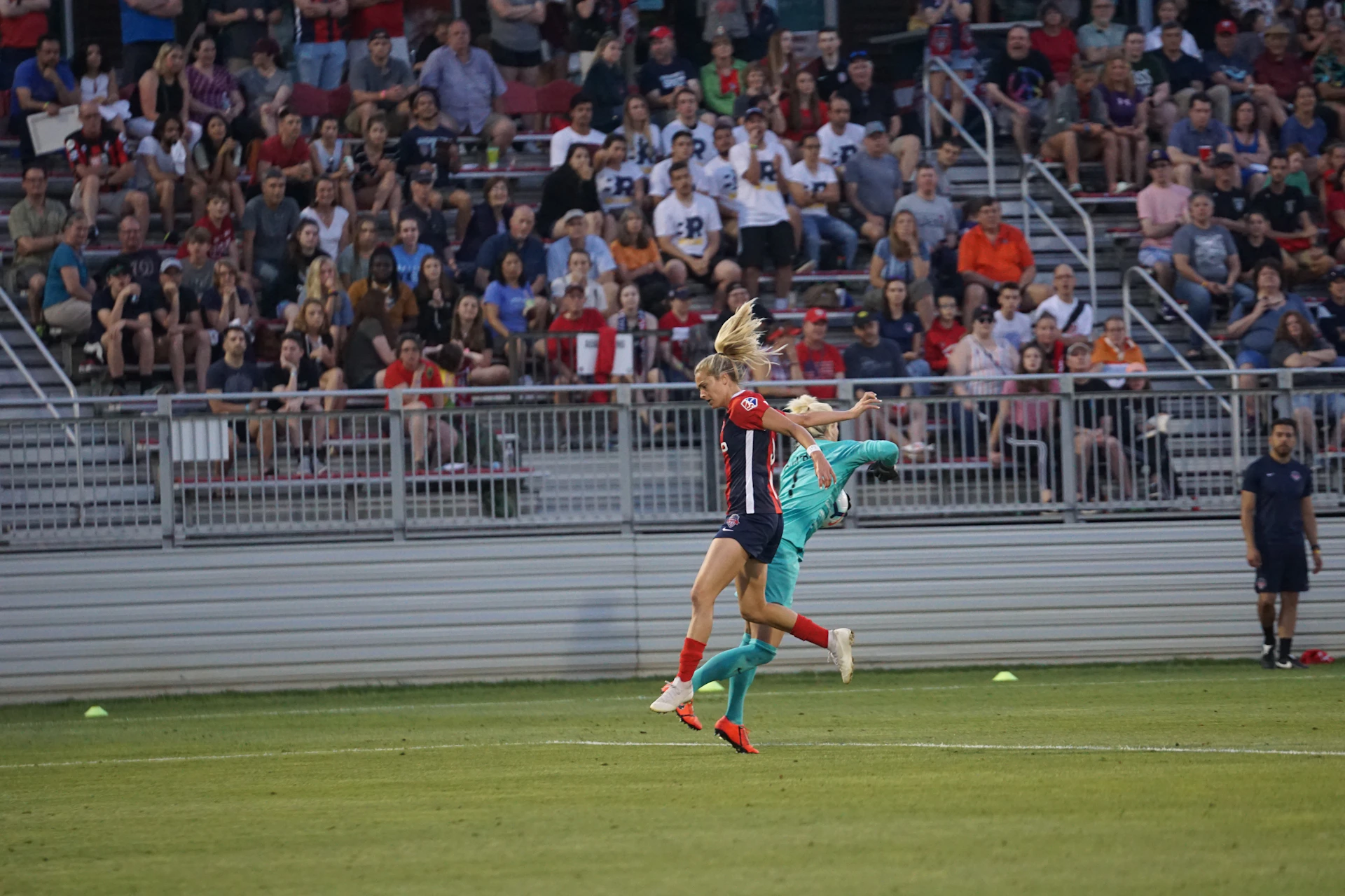 A dynamic action shot of Felipaos FC players in their sky blue and electric blue jerseys, fiercely competing on the field with the swan mascot emblem visible.