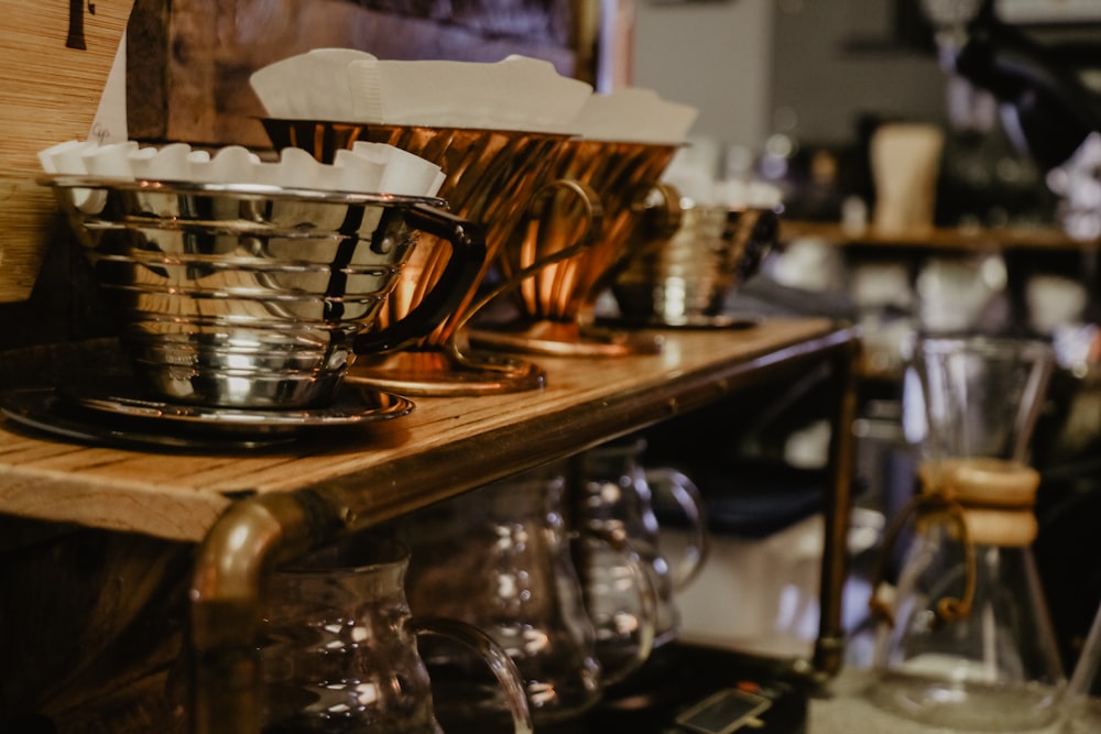 selective focus photography of buckets on table