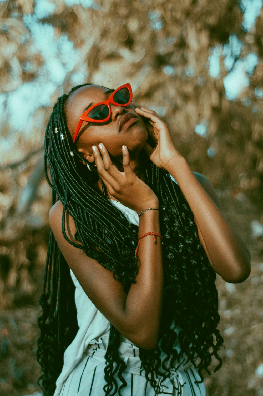 woman wearing red sunglasses