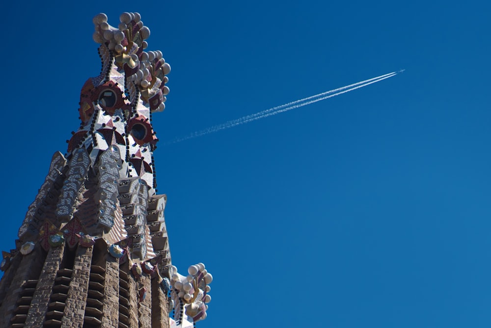 plane with smoke trail over temple