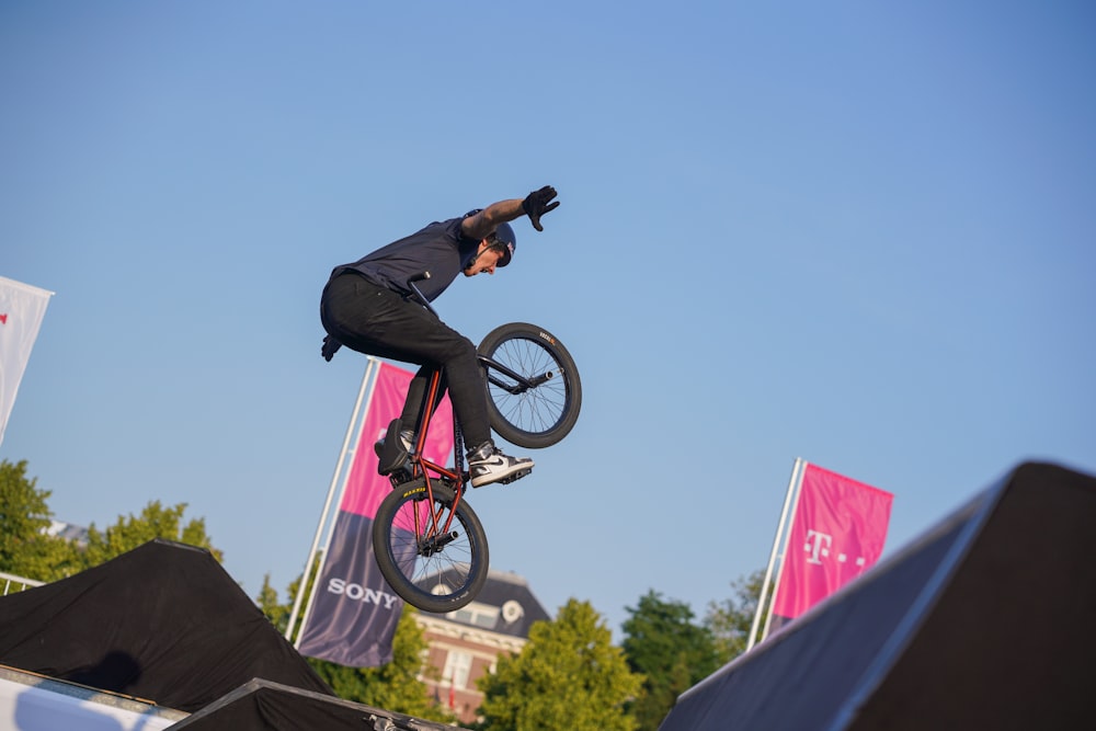 man doing BMX trick in the air