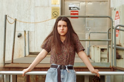 woman in brown button-up shirt and blue jeans rhode island google meet background