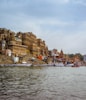 boat parked beside island with buildings