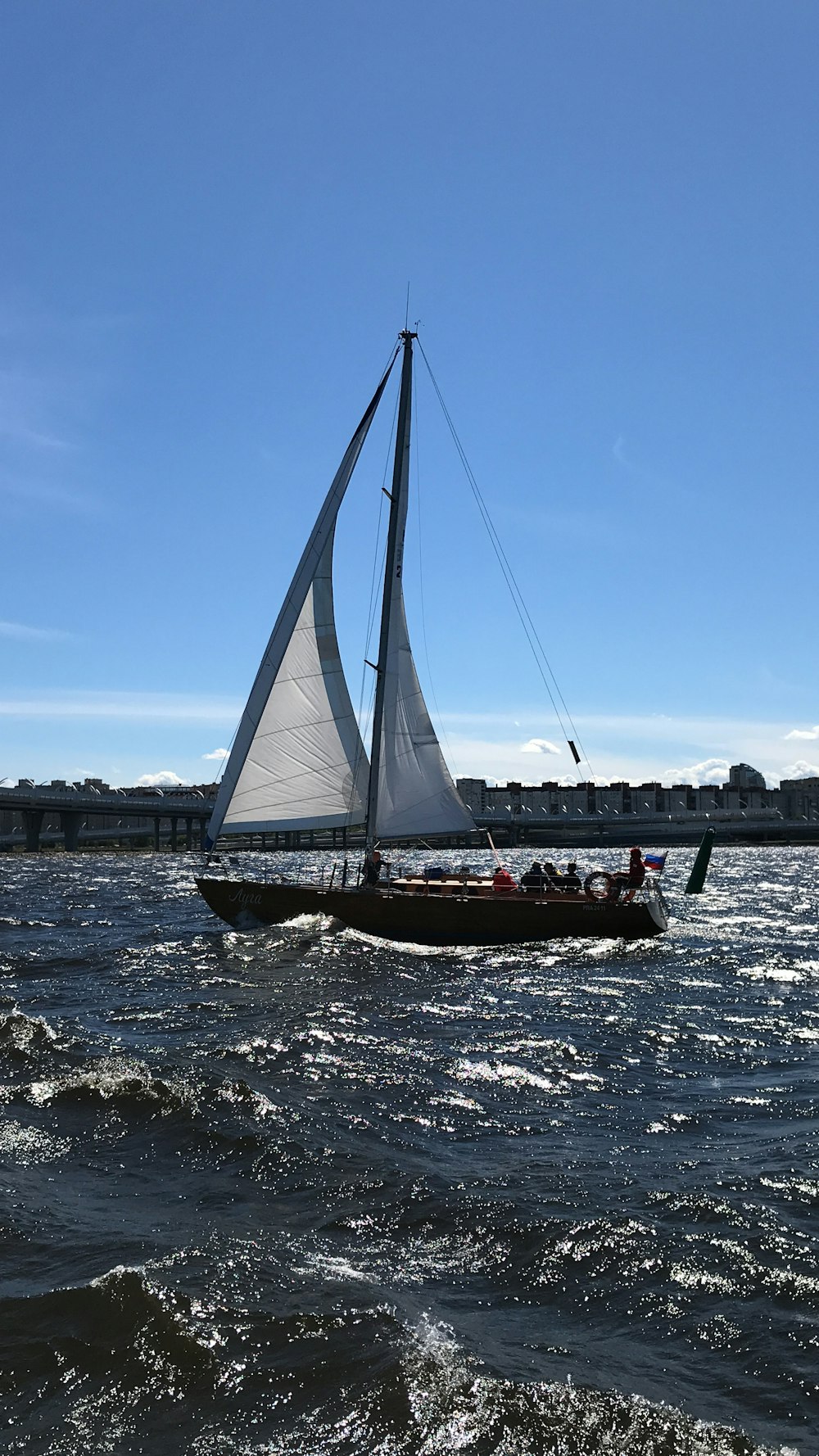 white sail boat on focus photography