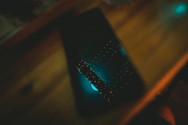 An iPhone screen showing network diagnostics, illuminated by ambient space-themed lighting.