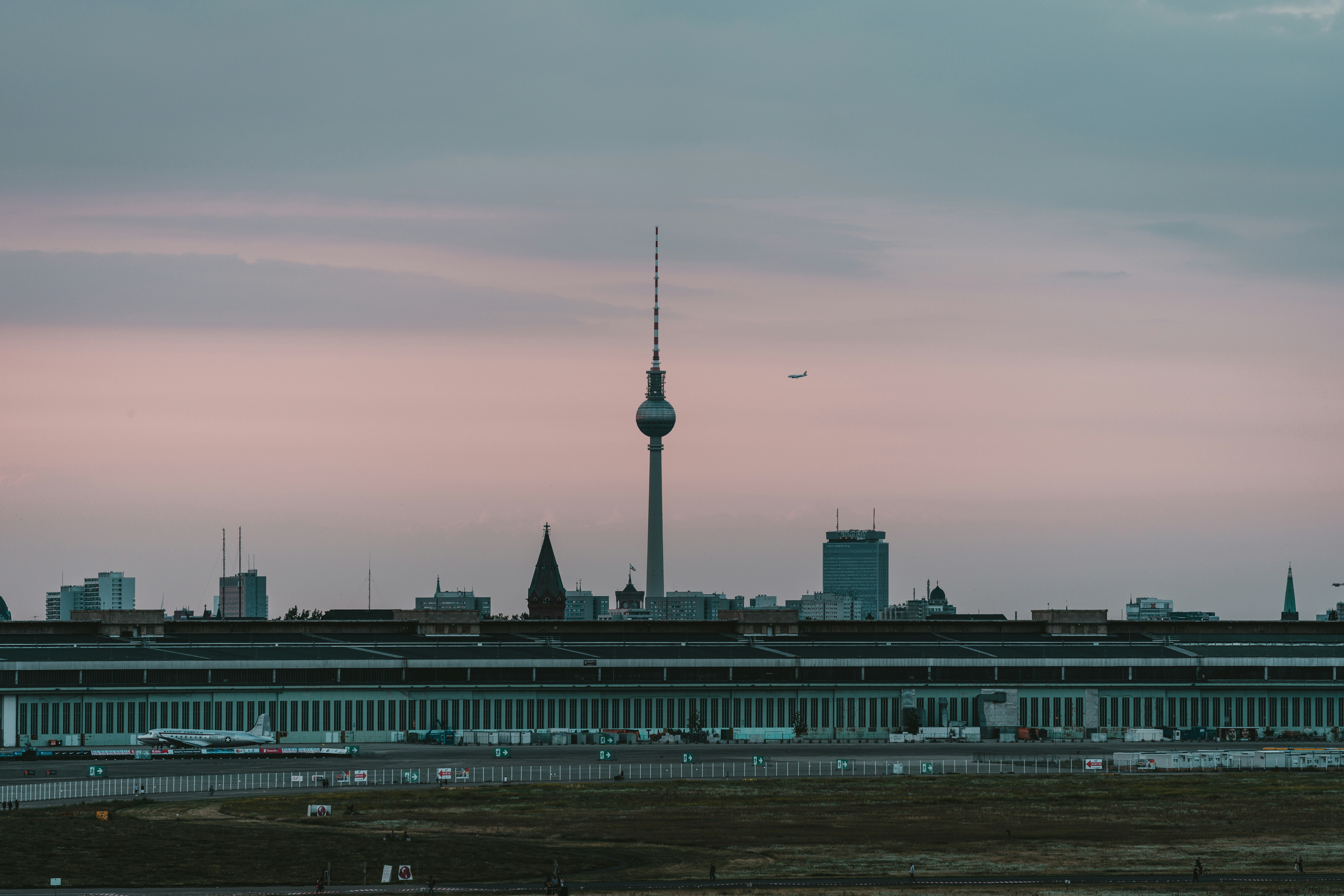 a large building with a tower in the background