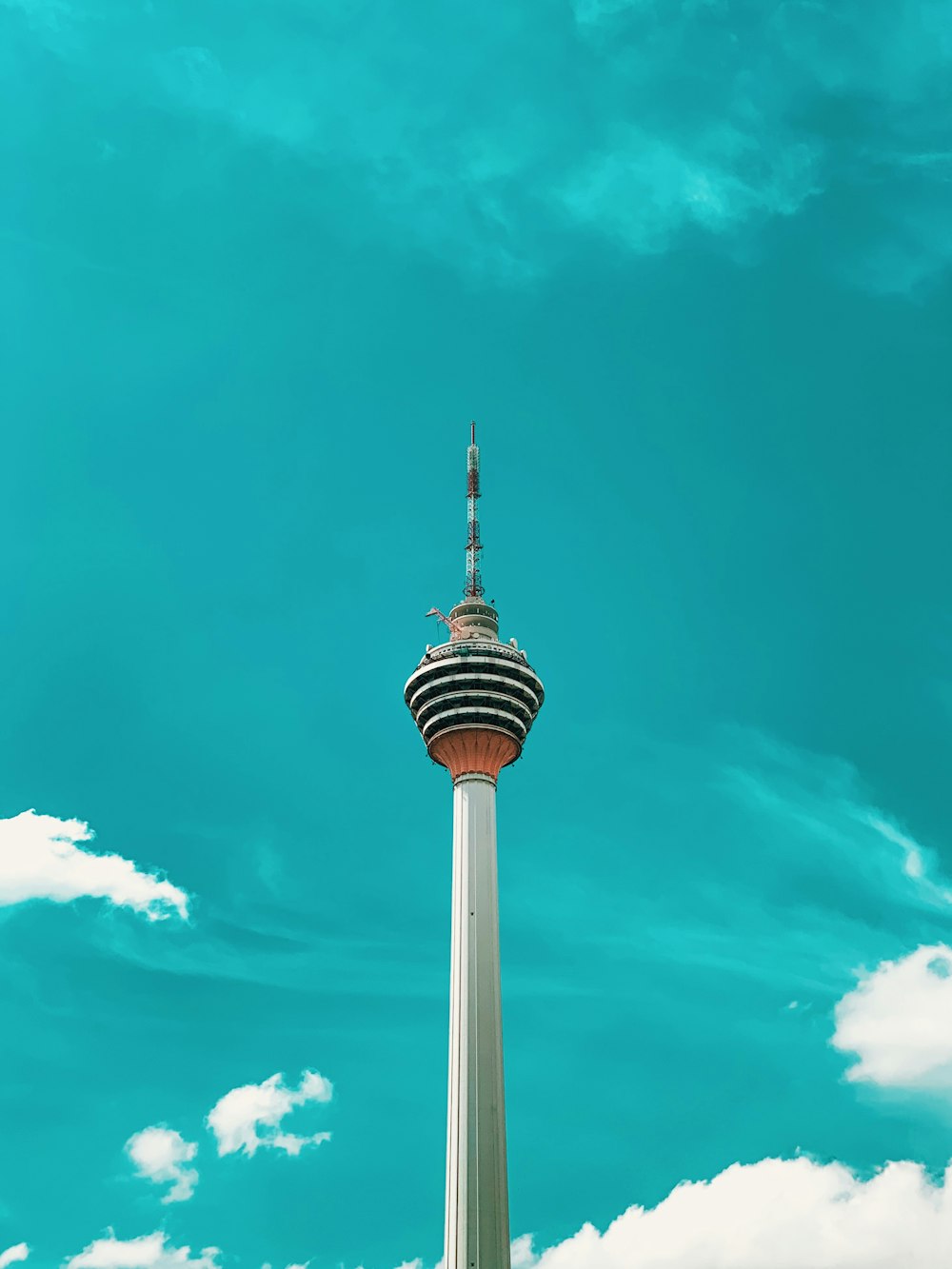 white and black tower building under blue sky