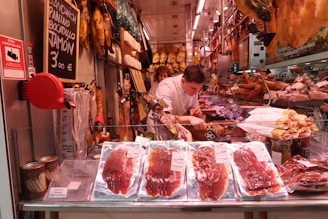 man slicing raw meat
