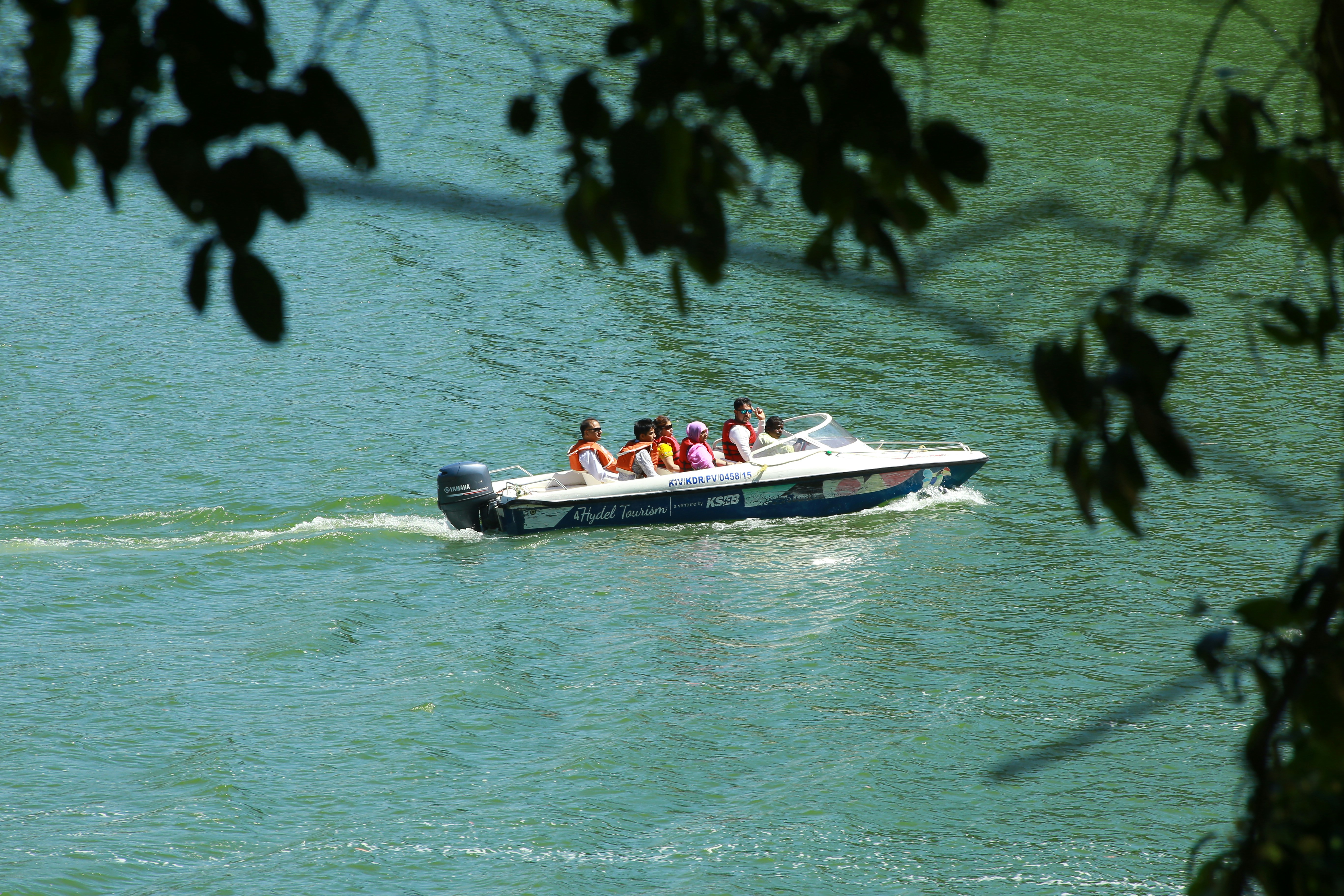 people in powerboat on ocean, 