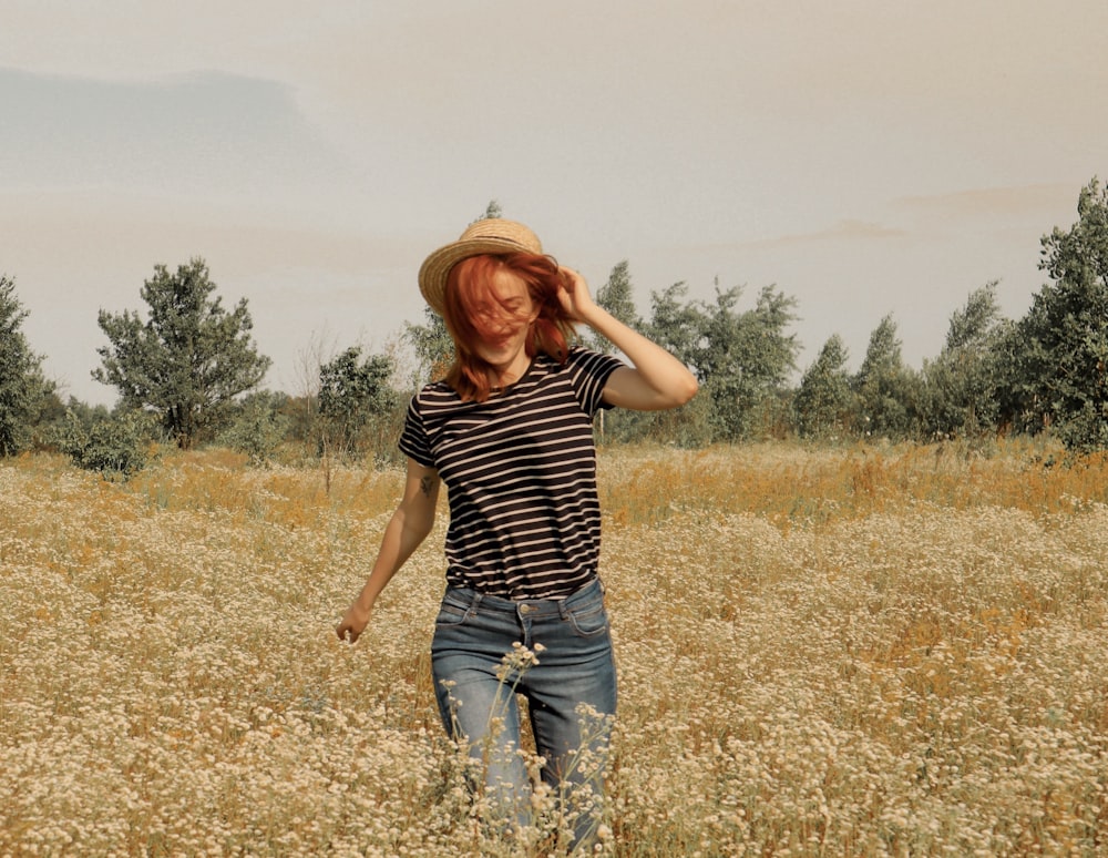 man standing on brown field