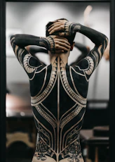 person wearing full body tattoo art