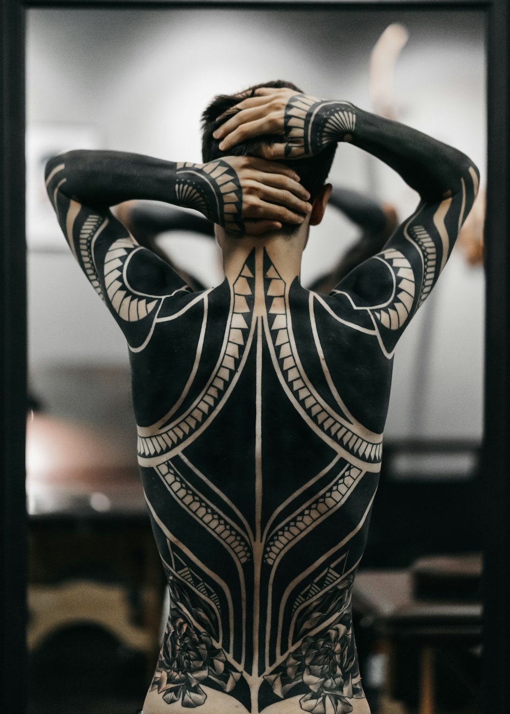 person wearing full body tattoo art