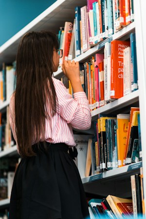 Children's books organized neatly on a school library shelf, representing reading and literacy support in elementary schools