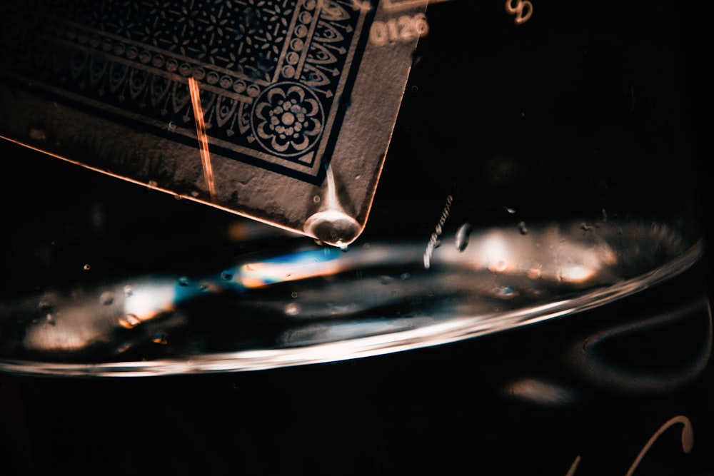 a close up of a spoon in a bowl of water